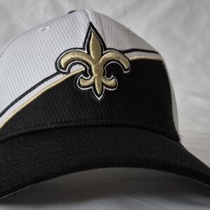 Elegant Black and White Cap with Gold Fleur-de-Lis